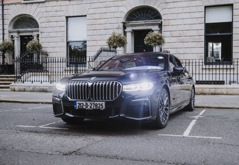 Black BMW 745Le exterior, parked outside a Dublin Georgian building